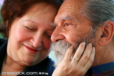 Affectionate old couple with the wife holding ...